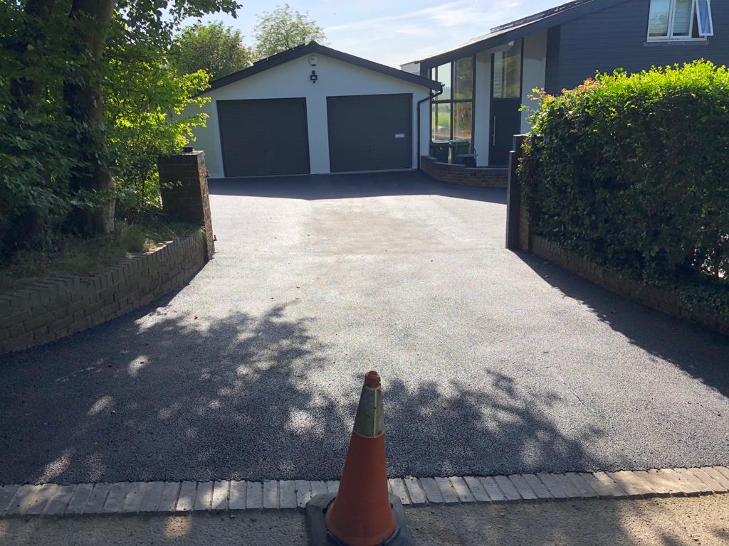 This is a photo of a bitumen driveway which is in the process of being installed by Sunshine Road Tech