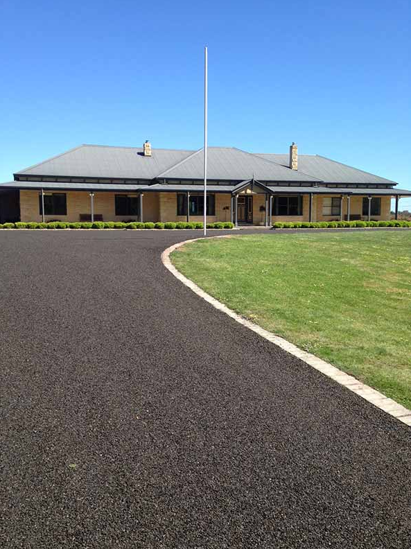 This is a photo of an asphalt driveway which has been installed by Sunshine Road Tech